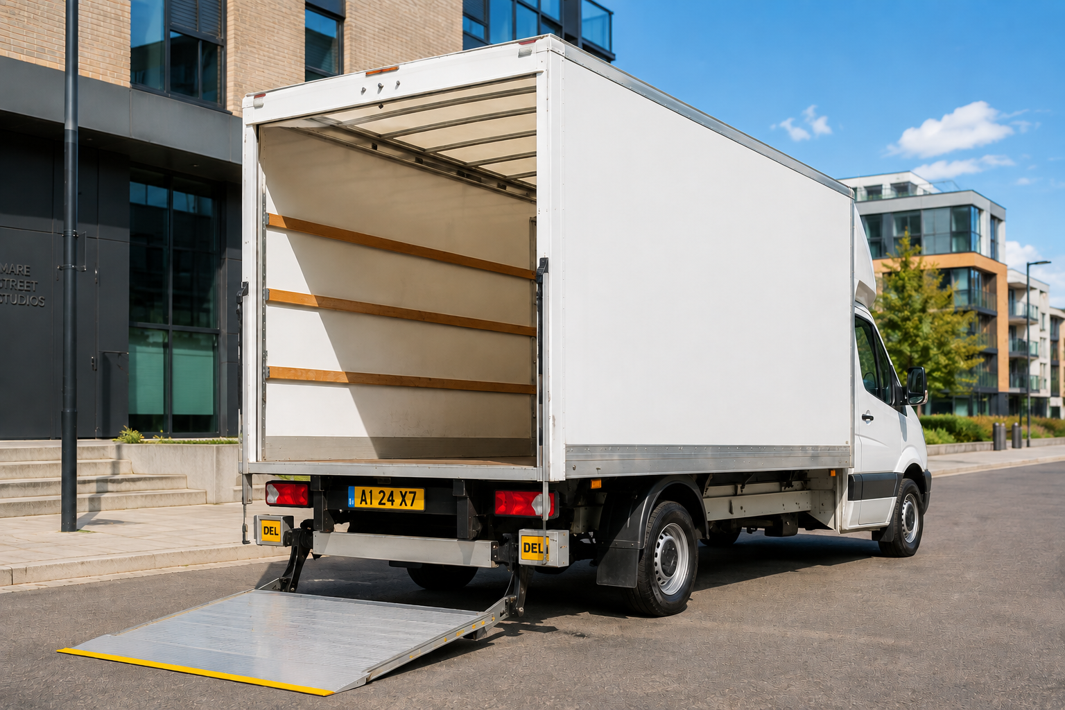 Man and van service loading furniture into a Luton van in London